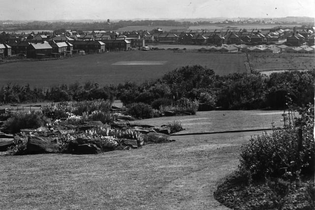 View from the Rock Gardens in Devonshire Road looking east. The tower (top left of centre) is Carleton Crematorium. The flat roofed building beyond the playing field is Arnold School for Girls ( later Greenlands) and the low buildings on the right were the Warbreck Hill government offices.The houses on Bispham Road and the junction with Samlesbury Avenue can also be seen, 1957