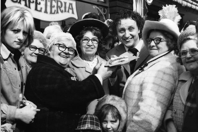 A large crowd of fans and a large jam butty (freshly caught in the Irish Sea) greeted comedian Ken Dodd in 1974. Ken was in Blackpool for the official opening of a new cafe, the Chuck Wagon in Deansgate, owned by Gerard Naprous and his partner Tina