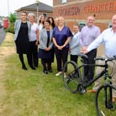 Anthony Hoskisson (second right) with colleagues preparing for his cycling challenge