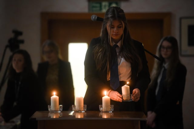 Lighting at candle at the synagogue