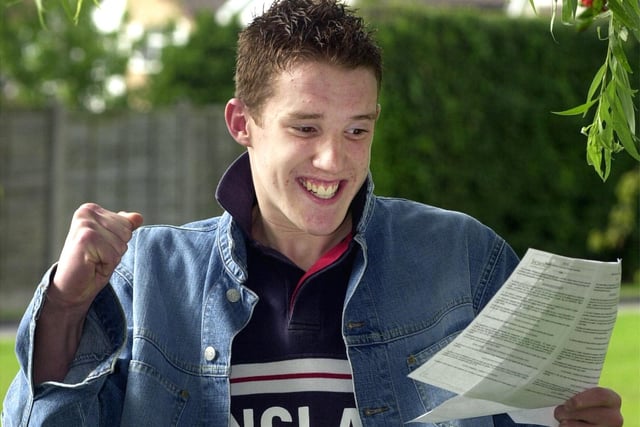 GCSE results day at St George's High School, 2001. Adam Gill celebrates his 12 passes