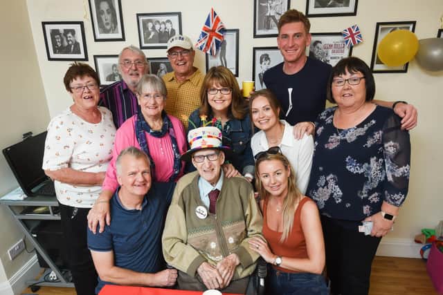 Henry Hampson celebrates his 100th birthday with family and staff from Hollins Bank Care Home in South Shore