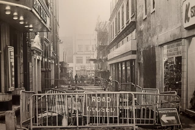 This shows the small section of Corporation Street which runs from Church Street to Victoria Street. The Grand Theatre, as a bingo hall, to the left with K Shoes to the right. What year was this?