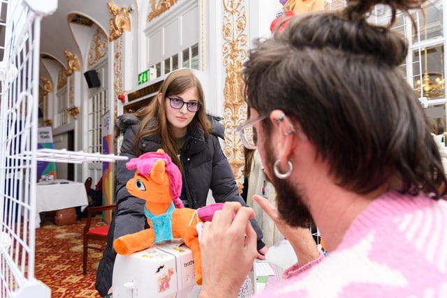 A student visits a sewing stall at the Winter Garden's Creative Cultural Careers event