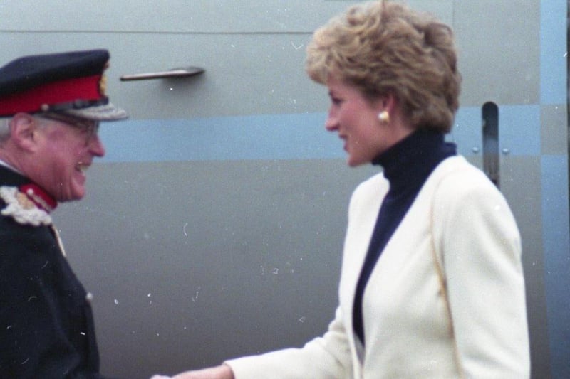 Princess Diana receives a warm welcome from a host of local dignitaries as she arrives at Warton aerodrome in an RAF aircraft, for her visit to Lancashire