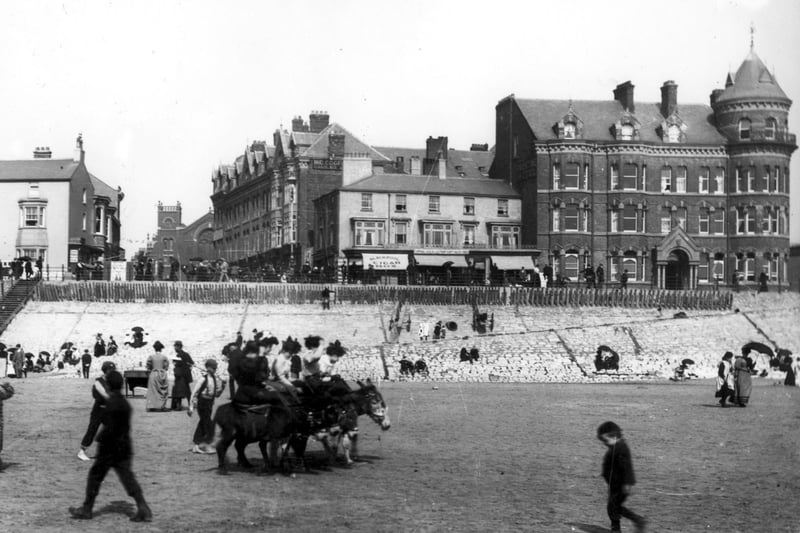 Donkey rides on the beach in front of the old Palatine Hotel (right) and the bottom end of Adelaide Street. On the left is the Royal Hotel - where the imposing Woolworths building  was later built. This is 1898
