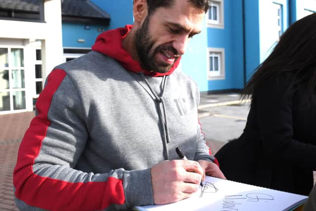 Eventual series winner Kelvin Fletcher signs an autograph on arriving at his hotel in Blackpool for Strictly's 2019 Blackpool Tower Ballroom show. Picture: Darren and Dave Nelson.
