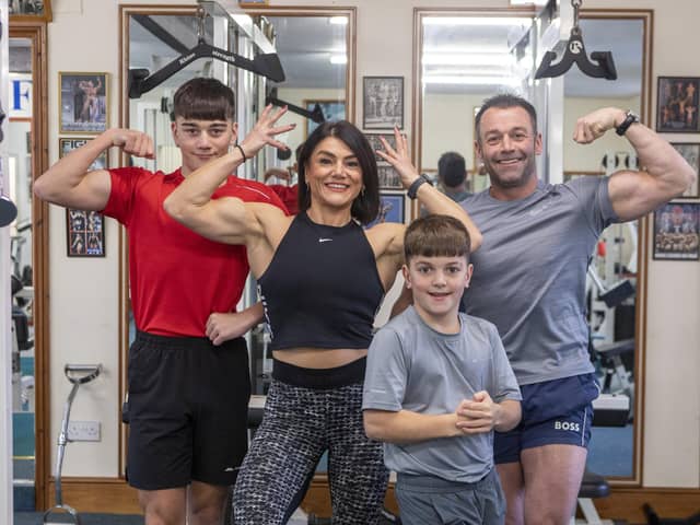 Bodybuilding family, Kerry MacDonald, 43, Steven Johnston, 47, Oliver, 14 and Aaron, 11 training at Ted's Gym in Workington, Cumbria.