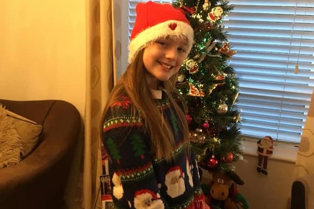 10-year-old Summer celebrates Christmas Jumper Day with a Santa theme.