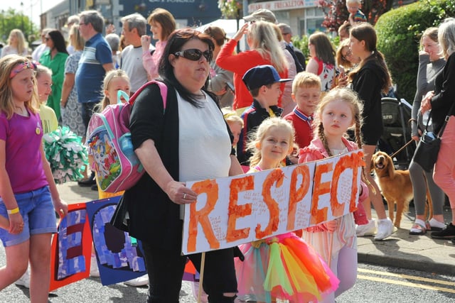 Members of the community take part in the Freckleton Club Day procession through the village.