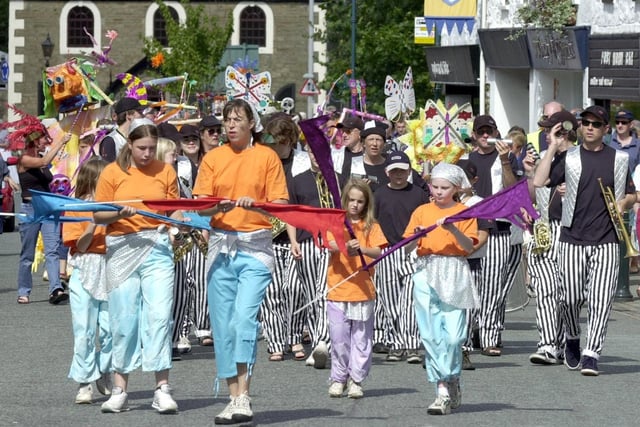 The 'Baybeat' carnival band leads the Celebration Of Arts Festival parade through Garstang
