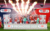 LONDON, ENGLAND - MAY 30: Chris Maxwell of Blackpool lifts the Sky Bet League One Play-off Trophy as his team mates celebrate following victory in the Sky Bet League One Play-off Final match between Blackpool and Lincoln City at Wembley Stadium on May 30, 2021 in London, England. (Photo by Catherine Ivill/Getty Images)