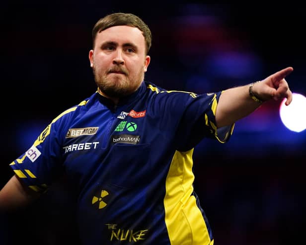 Luke Littler celebrates after a match during the 2025 BetMGM Premier League earlier this month. Picture: Zac Goodwin/PA Wire