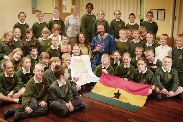Story teller Anjum Anwar and Bruce Crowther of the Garstang Oxfam group (pictured centre), visit Carleton St Hilda's CE Primary School as part of a nationwide scheme to break down stereotypes in 2006