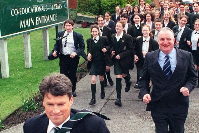 Colin White leads the practise for a fun run, followed by Headmaster William  Gillen and some of the Arnold School pupils in 1999