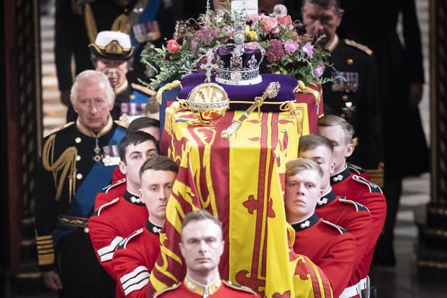 King Charles III and members of the royal family follow behind the coffin of Queen Elizabeth II, draped in the Royal Standard with the Imperial State Crown and the Sovereign's orb and sceptre, as it is carried out of Westminster Abbey after her State Funeral. Picture date: Monday September 19, 2022.See PA story FUNERAL Queen. Photo credit should read: Danny Lawson/PA Wire