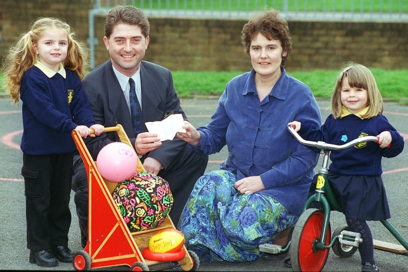 Youngsters at Mereside Primary School nursery benefitted from hundreds of pounds-worth of outdoor equipment, thanks to a donation from Royal Mail in 2000
Pic L-R: Simone Threlfall (3), Royal Mail Area Manager Robert Wilson, Nursery Teacher Christine Davies, and Nicole Menzies (4).