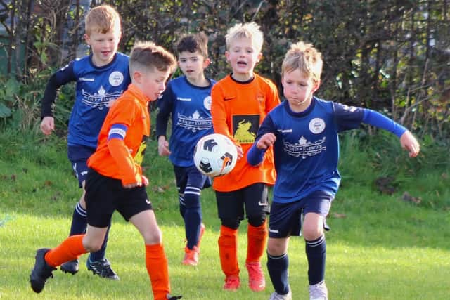 Action from the game between YMCA Orange and Elswick & Inskip Blues Picture: Karen Tebbutt