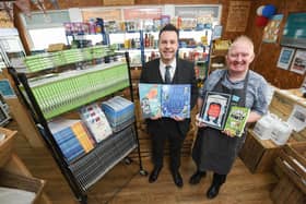 Peter Wright and Chris Lowry with books donated to the Community Grocery in Blackpool