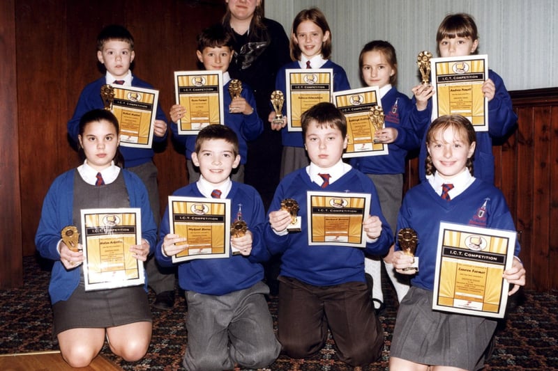 Children from Bispham Endowed Primary School who won trophies and certificates in an IT competition in 2000. Top: L to R- Robert Hallett, Ryan Farmer, teacher Miss Norbury, Rebecca Edmondson, Ashleigh Collins, Andrea Remett. Front: L to R- Helen Ackerley, Mykael Burns, Richard Bowen and Lauren Farmer.