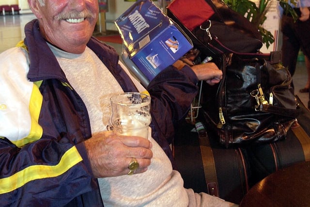 Bill Haggarty from Blackpool relaxes with a pint on his return from Tenerife in 2001