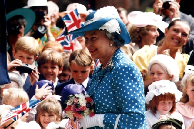 Queen Elizabeth II and the Duke of Edinburgh visited Rossall School and Blackpool in 1994. This photo shows The Queen greeted by excited children from the school