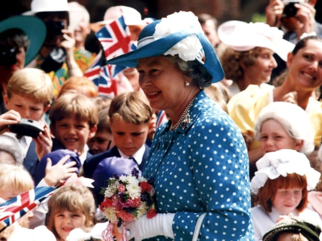Queen Elizabeth II and the Duke of Edinburgh visited Rossall School and Blackpool in 1994. This photo shows The Queen greeted by excited children from the school