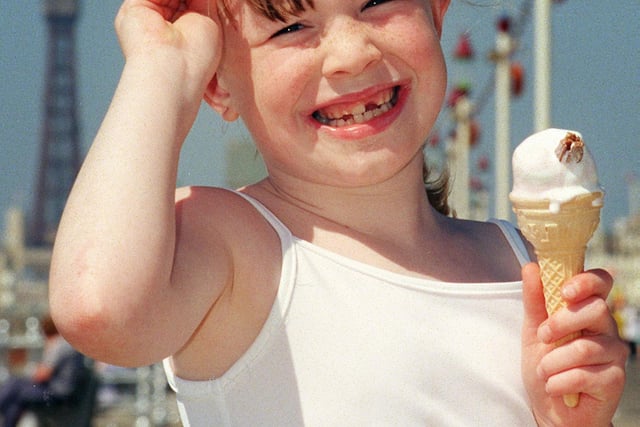 Eight year old Kirsty Wallace tries to keep cool on Blackpool Promenade in 1999