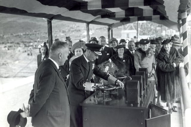 King George VI turns the valve control wheel to officially open Ladybower Reservoir on September 25, 1945