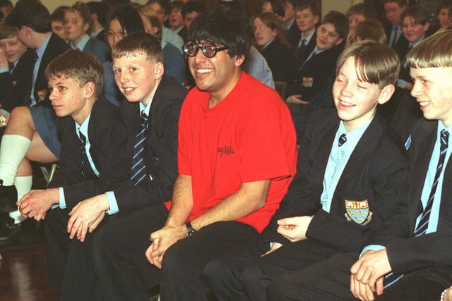 Byker Grove actor Sajid Varda takes a seat with the Collegiate High School pupils, during the Crag Rats Theatre Group visit to the school in 1997