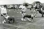 The start of the upper junior wheelbarrow race for boys and girls at Carters Charity School sports day, 1966