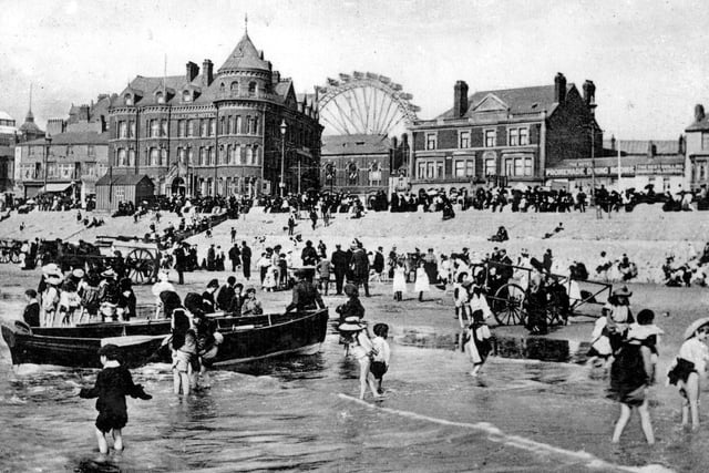 Boat trips were kept busy as youngsters paddled in the waves in this 1905 view. the Palatine Buildings and Big Wheel are pictured in the background