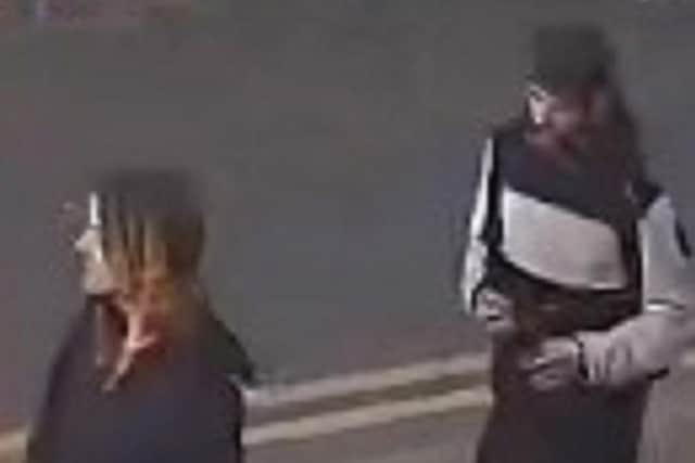 Officers would like to speak to these two people in connection with the robbery (Credit: Lancashire Police)