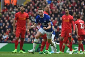 TOPSHOT - Everton's English defender Matthew Pennington (2nd L) celebrates after scoring their first goal during the English Premier League football match between Liverpool and Everton at Anfield in Liverpool, north west England on April 1, 2017.