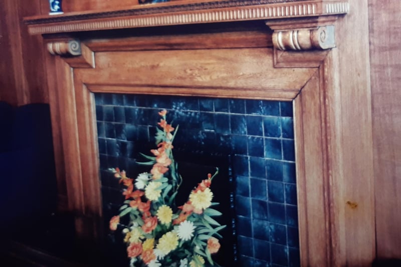 One of the grand oak fireplaces as it was in 1996
