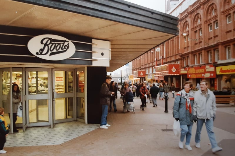 Another prominent scene of Boots in 1992 but also the American Pancake House and the entrance facade of the Tower  and Tower Lounge can be seen