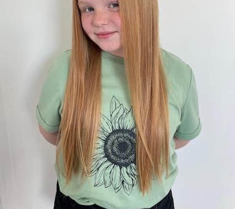 Megan Hogarth, 11, before she had her hair cut for charity