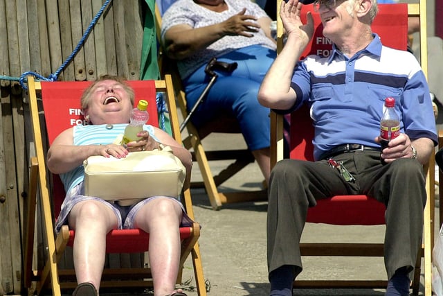 Happiness is sun-shaped - this elderly couple share a moment in 2002