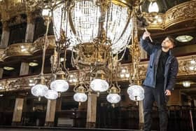 Tower ballroom team member Josh Taylor cleans one of Blackpool Tower’s two huge chandeliers during their annual clean. (Danny Lawson/PA Wire)