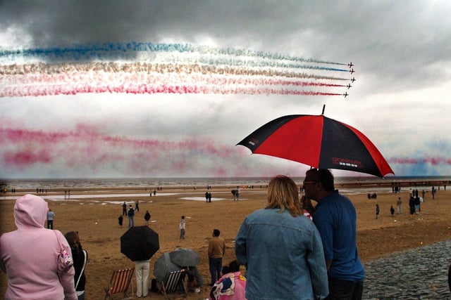 It was all unbrellas and rain coats in 2006 as crowd watching the Red Arrows. Weather's looking much better for this year's event