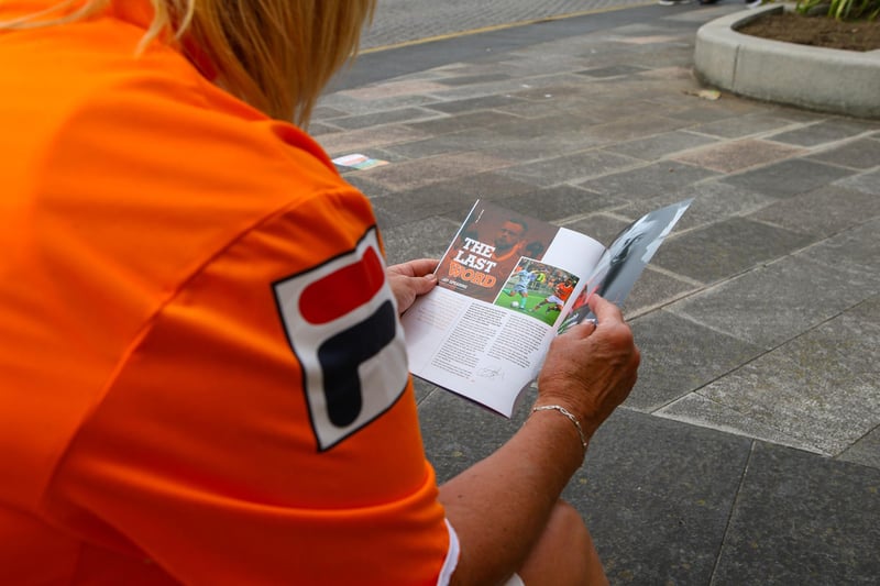 Football fans still enjoy collecting and reading match day programmes.