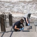 Water samples are taken from Cleveleys beach following a pollution incident (Credit: Daniel Martino)