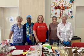 Sarah from Santander helps out a the cake stall