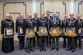 New Provincial Grand Master of West Lancashire Mark Matthews (centre) surrounded by the team from the United Grand Lodge of England