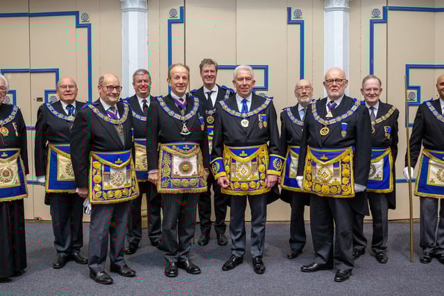 New Provincial Grand Master of West Lancashire Mark Matthews (centre) surrounded by the team from the United Grand Lodge of England