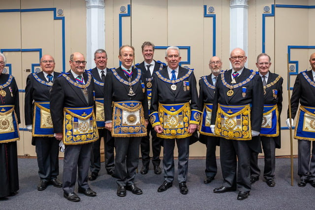 New Provincial Grand Master of West Lancashire Mark Matthews (centre) surrounded by the team from the United Grand Lodge of England