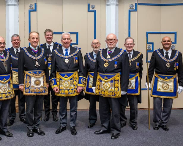 New Provincial Grand Master of West Lancashire Mark Matthews (centre) surrounded by the team from the United Grand Lodge of England