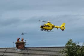 The air ambulance landing close to the scene of the incident on Sunday afternoon. Picture: Facebook/Thomas Harrison.