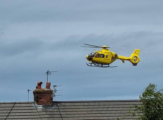 The air ambulance landing close to the scene of the incident on Sunday afternoon. Picture: Facebook/Thomas Harrison.