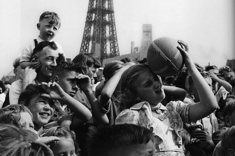 Children watch the entertainment on Blackpool promenade in 1949. Photo: John Gay/Historic England/Mary Evans